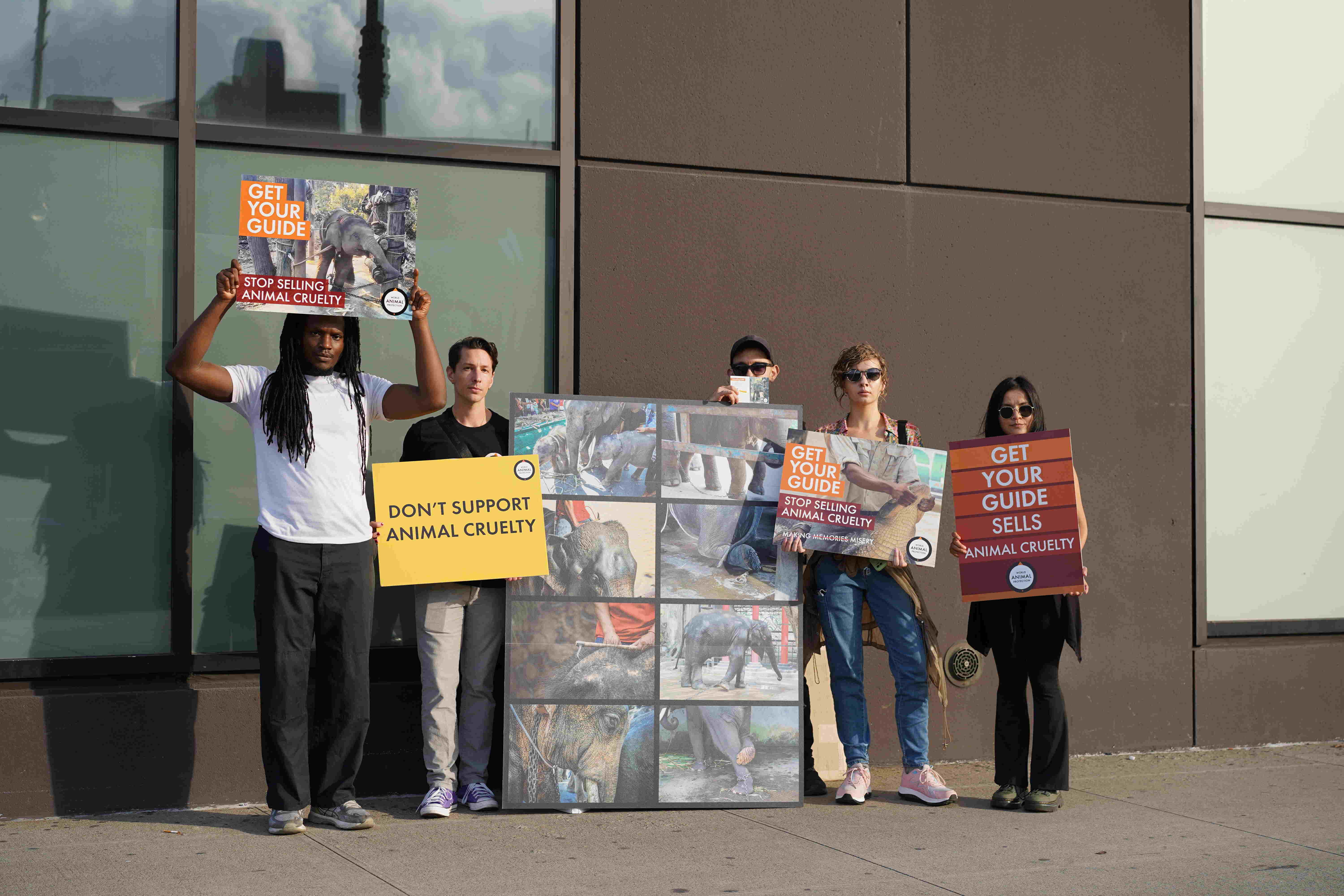 The World Animal Protection team and volunteers protesting GetYourGuide outside Skift Global Forum at the Glasshouse in NYC.